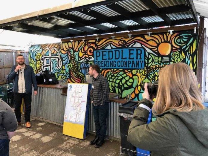 Owen and Doug address fundraiser attendees at Peddler Brewing. (Photo by Rian Watt)