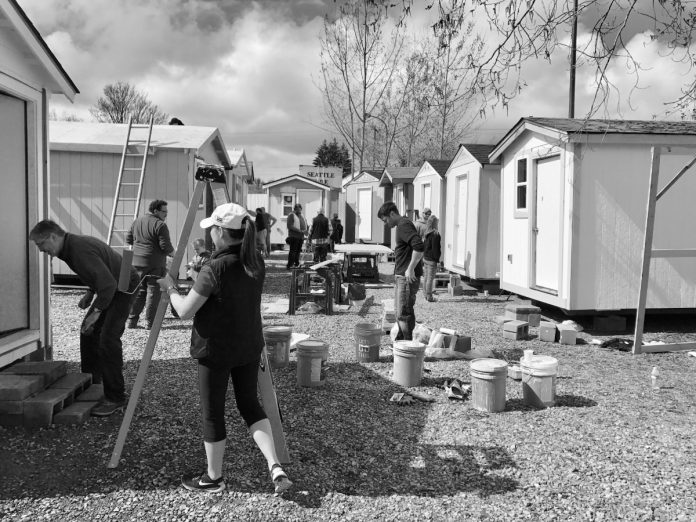anton dekom georgetown tiny house village Volunteers building and painting tiny houses at Georgetown Village in March of 2017. (Photo by the author)