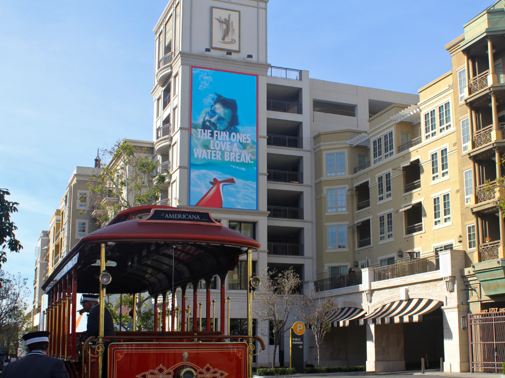 View of Americana at Brand parking lot, lower level retail space, apartments, and trolley. (Photo by Leilani Commons)