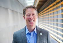 Budget Reckoning Has Pedersen Calling for Cuts, Not Corporate Taxes Alex Pedersen poses in a suitcoat in a City Hall hallway