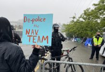 Op-Ed: Policing Will Never Solve Homelessness, Housing Will Police were out in force to barricade onlookers from a sweep of Weller Street in the CID. (Photo by Enrico Doan)