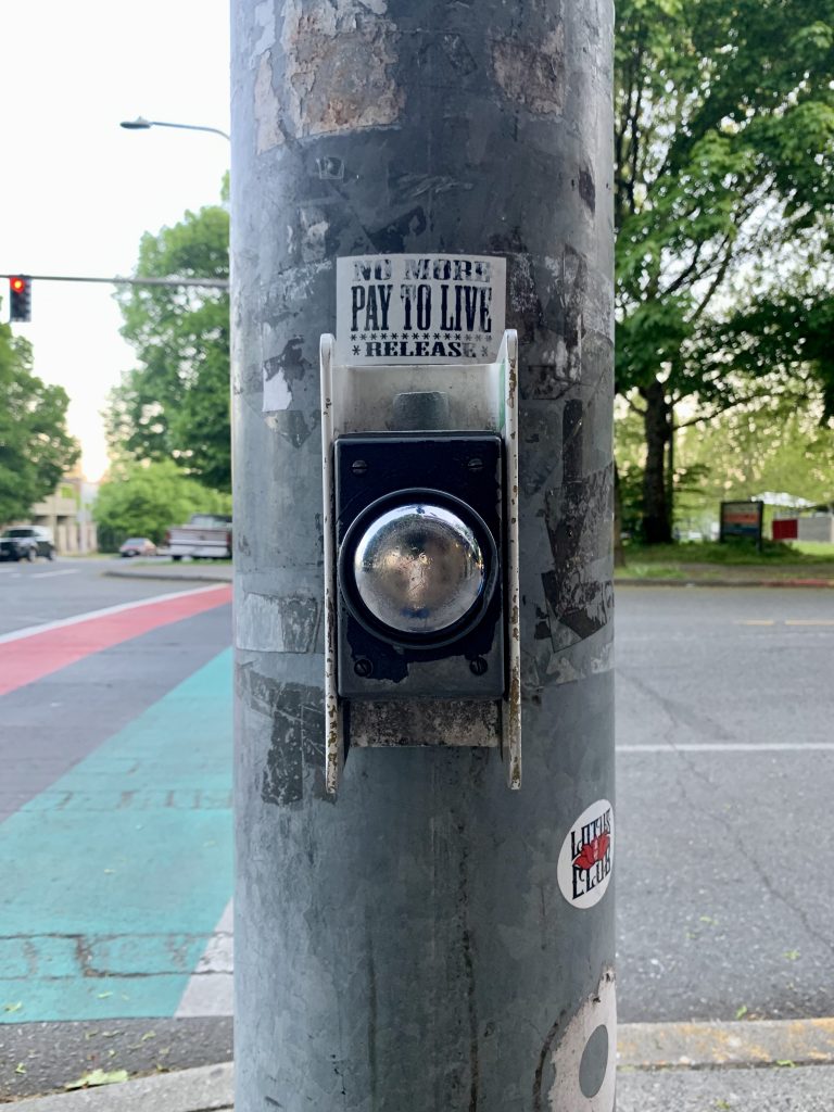 An example of a push button that needs to be activated to trigger the walk signal (aka. beg button) in the Central District. (Photo by author)