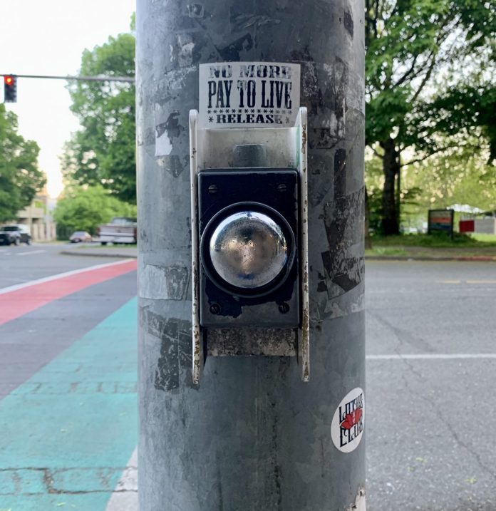 An example of a push button that needs to be activated to trigger the walk signal (aka. beg button) in the Central District. (Photo by author)