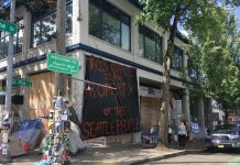 Protesters Seize East Precinct and Gain Backing for Siphoning Off SPD Funding "Welcome to the Capitol Hill Autonomous Zone" reads a new sign on Pine Street. (Photo by Michael Goldman)