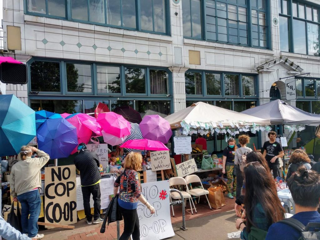 "No cop co-op" signs at the CHOP. (Photo by author)