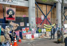 Op-Ed: Walking Away from the Empty Promise of Seattle’s Consent Decree The memorials along the East Precinct police station--now christened the Capitol Hill Community Center--keep growing. (Photo by Doug Trumm)