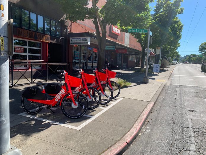 Lime-owned red Jump bikes in Ballard drop-off zone. (Courtesy of Lime)