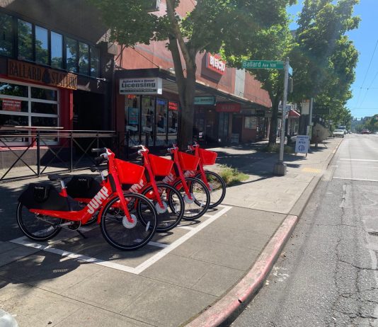 Lime Relaunches Bikeshare in Seattle with 500 Jump Bikes Lime-owned red Jump bikes in Ballard drop-off zone. (Courtesy of Lime)