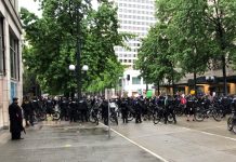 On Fifth Day of Protest, Mayor Durkan Pledges Changes but Won’t Surrender Her Tear Gas A large contingent of police barricaded 4th Avenue with their bicycles, blocking a route out of Westlake Park. (Photo by Robert Cruikshank)