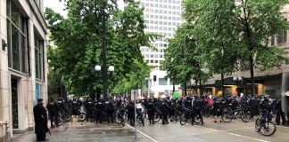 A large contingent of police barricaded 4th Avenue with their bicycles, blocking a route out of Westlake Park. (Photo by Robert Cruikshank)