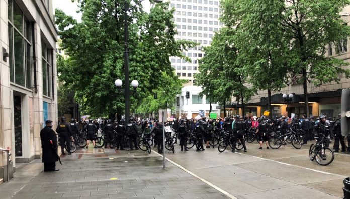 Police barricade A large contingent of police barricaded 4th Avenue with their bicycles, blocking a route out of Westlake Park. (Photo by Robert Cruikshank)