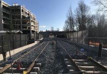 Sound Transit Grapples with Recession and Transit Expansion Rebalancing Light rail tracks near a Bellevue parking garage. Sound Transit's expansion timelines are under financial stress due to the Covid recession. (Photo by Stephen Fesler)