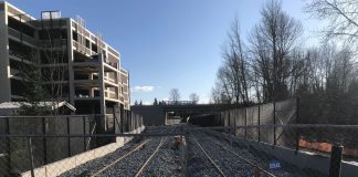Light rail tracks near a Bellevue parking garage. Sound Transit's expansion timelines are under financial stress due to the Covid recession. (Photo by Stephen Fesler)