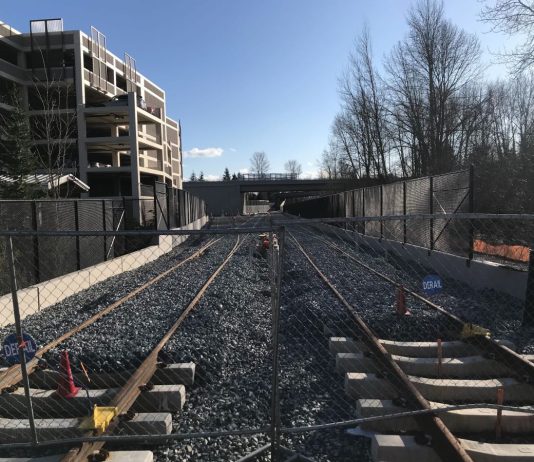 Sound Transit Grapples with Recession and Transit Expansion Rebalancing Light rail tracks near a Bellevue parking garage. Sound Transit's expansion timelines are under financial stress due to the Covid recession. (Photo by Stephen Fesler)
