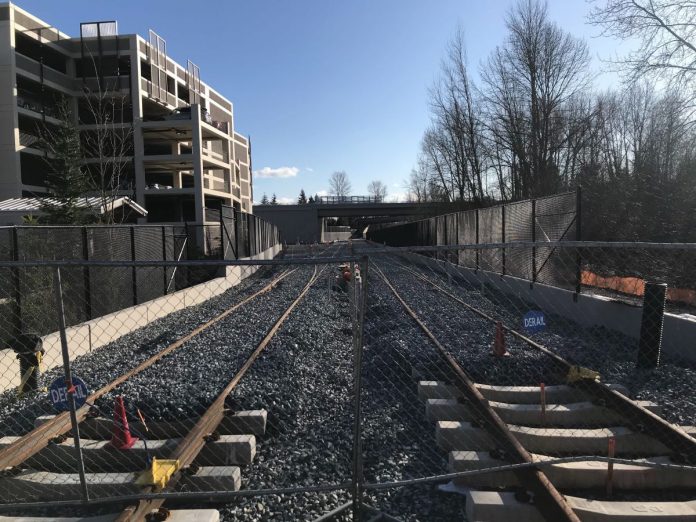 Light rail tracks near a Bellevue parking garage. Sound Transit's expansion timelines are under financial stress due to the Covid recession. (Photo by Stephen Fesler)