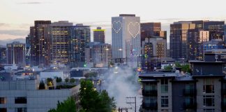 Tear gas rises near the East Precinct building on E. Pine St. on Monday, May 1, as police disperse a crowd of protestors. (Photo by Ethan Campbell)