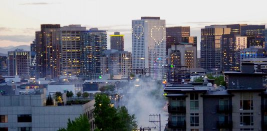 Tear gas rises near the East Precinct building on E. Pine St. on Monday, May 1, as police disperse a crowd of protestors. (Photo by Ethan Campbell)