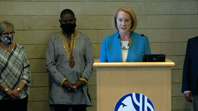 Mayor Jenny Durkan flanked by Andre Taylor at Monday press conference on the CHOP shooting. (Seattle Channel)