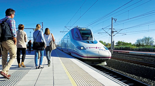 An high-speed train pulls into a station and passengers approach. (Photo courtesy Midwest High Speed Rail Association)