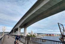The Urbanist’s Greatest Hits of 2020 People bike on the low bridge with the cracked high bridge looming overhead. (Photo by Doug Trumm)