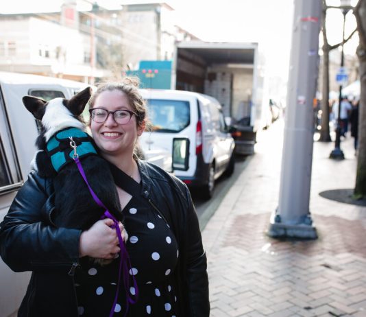 2020 Endorsement Questionnaire: Jessi Murray, LD43-2 Jessi Murray poses on the sidewalk with her dog in her arms.