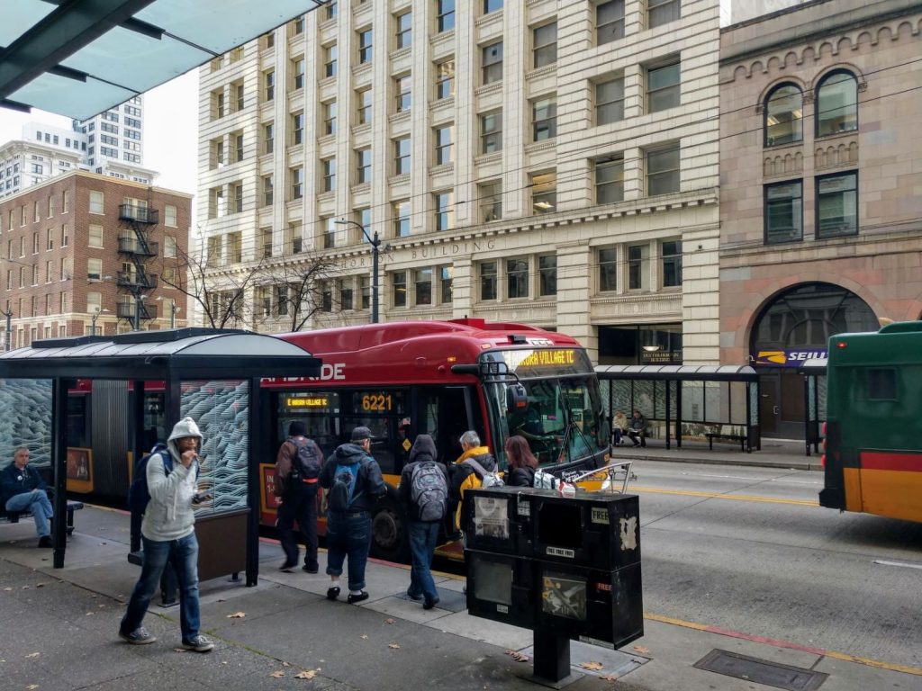 Riders board the RapidRide E, which gets a big boost from the STBD, on Third Avenue in Downtown Seattle. (Photo by Doug Trumm)