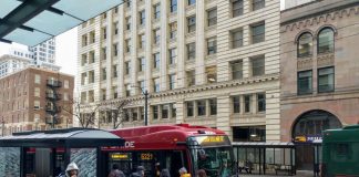 Riders board the RapidRide E, which gets a big boost from the STBD, on Third Avenue in Downtown Seattle. (Photo by Doug Trumm)