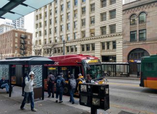 Fast, Frequent Transit Would Drive Ridership Rebound, Commute Seattle Survey Shows Riders board the RapidRide E, which gets a big boost from the STBD, on Third Avenue in Downtown Seattle. (Photo by Doug Trumm)