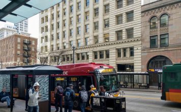 Fast, Frequent Transit Would Drive Ridership Rebound, Commute Seattle Survey Shows Riders board the RapidRide E, which gets a big boost from the STBD, on Third Avenue in Downtown Seattle. (Photo by Doug Trumm)