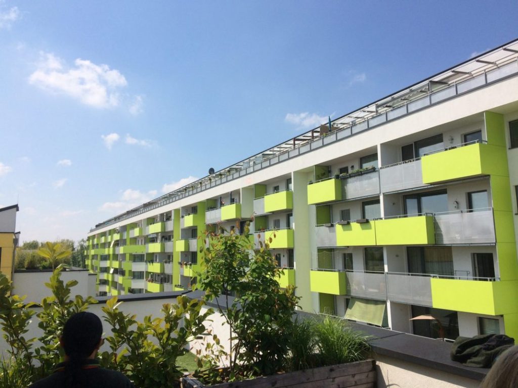 A large lime green seven-story apartment building in Vienna. (Photo by Mike Eliason)