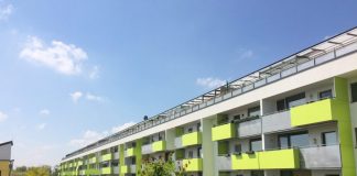 A large lime green seven-story apartment building in Vienna. (Photo by Mike Eliason)
