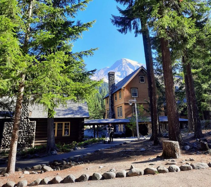 20200809_085300 Some Douglas firs and Mount Tahoma frame National Park Inn wooden lodge in Longmire.