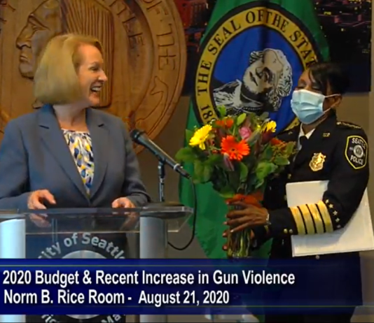 Mayor Durkan Vetoes Rebalancing Package Decrying Police Cuts, ‘Irresponsible’ Investments Mayor Jenny Durkan gave soon-to-retire Police Chief Carmen Best some flowers to express her gratitude during a press conference about blocking police budget cuts in the Norm Rice room at City Hall. (Seattle Channel)