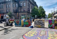 Join Seattle Greenways at Our Meetup Tuesday to Discuss Open Streets and Moving Beyond Enforcement The B from the Black Lives Matter street mural next to barricades with Oddfellows building in the background.