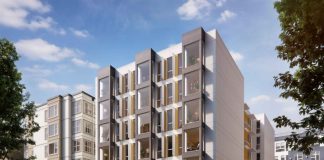 Seattle Social Housing Developer Strives for High Sustainability and Affordability Standards A white six story building with jutting windows.