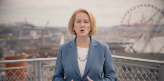 Mayor Durkan with Ferris wheel and Seattle waterfront in background