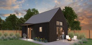 Backyard cottage with woman in patio and sunset.