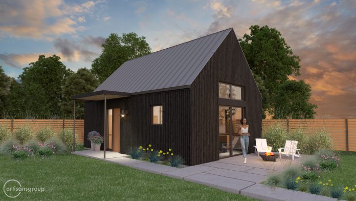 Backyard cottage with woman in patio and sunset.