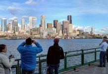 The Urbanist Announces New Paid Freelance Reporter Program Downtown Seattle skyscrapers seen from a ferry in Elliott Bay