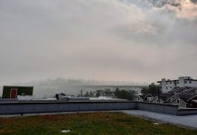 Cascadia Needs to Change Its Ways to Keep from Burning Up Fremont rooftops with a haze of smoke over and sun barely poking through.