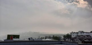 Fremont rooftops with a haze of smoke over and sun barely poking through.