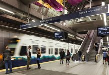 Automated Trains Could Propel ST4 and Lower Energy Costs An underground light rail station with a train and passengers.