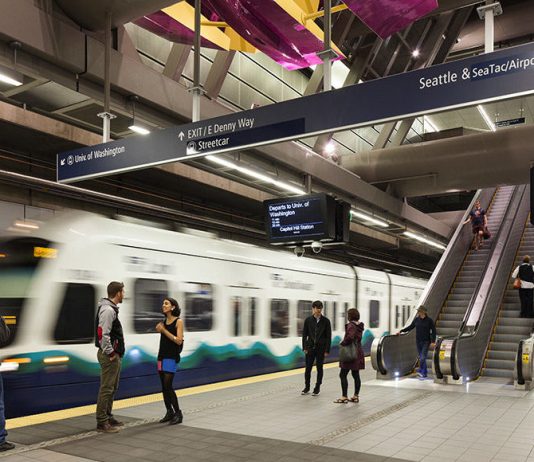 Automated Trains Could Propel ST4 and Lower Energy Costs An underground light rail station with a train and passengers.