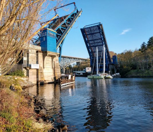 Mosqueda’s Budget Balancing Package Advances Progressive Priorities and Bridge Maintenance Bonds The Fremont Bridge goes up to let a catamaran pass.