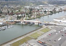Georgetown-to-South Park Trail Will Be a Reality Thanks to Council Budget An aerial photo of the South Park Bridge under construction with the Duwamish Valley in the background.