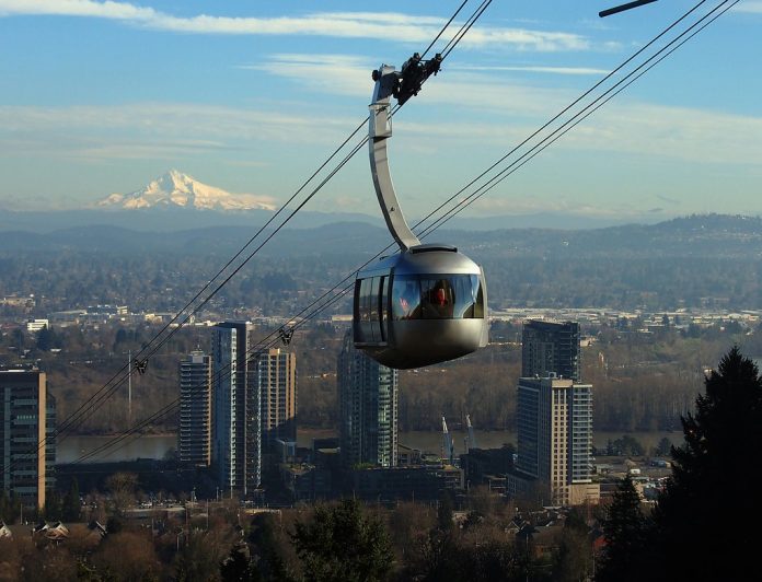 Mount Hood is in the background and the Portland aerial tram the foreground.