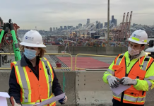 Will Electorate Blame Mayor Durkan for Four Years of Mismanagement? Mayor Durkan in an orange vest and SDOT hard hat at a West Seattle Bridge presser.