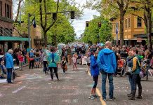 Olympia Enacts Targeted Citywide Missing Middle Housing Reform, Using GMA and SEPA ‘Safe Harbor’ People throng the street closed for a festival.
