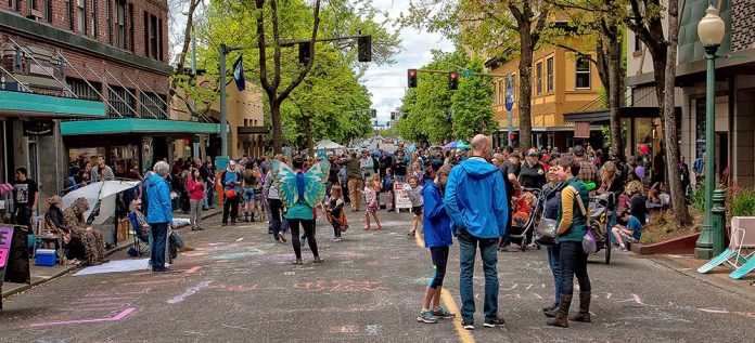 People throng the street closed for a festival.