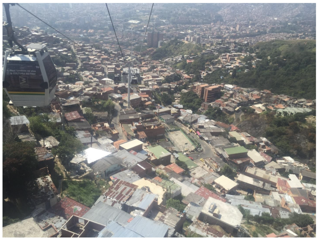 Planning mass transportation in this section of Medellíin would be overly complex and expensive while also displacing thousands of people. Here, a gondola is appropriate. It will reach these areas and not cause disruption and displacement. (Credit: Reading Running Cycling blog)